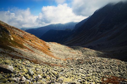 landscape background dark fog over the granite scree valley