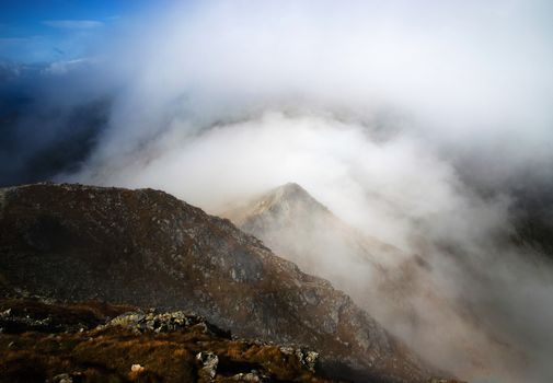 nature lanscape background fog lying over the top of the mountain