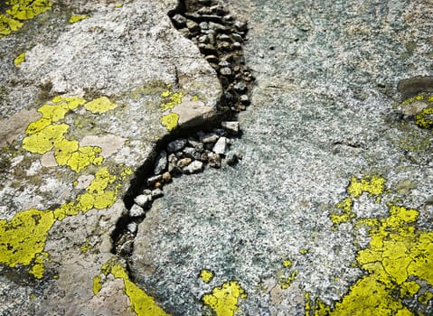 background or texture detail on granite rocks with yellow moss