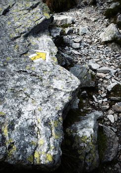 background moutain stone granite walkway with a yellow arrow