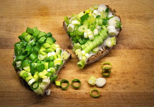 food background bread with ointment and chopped onion