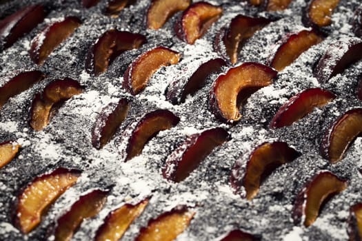 food background abstract detail poppy pie with plums