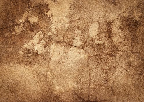 abstract background or texture old ocher plaster with cracks