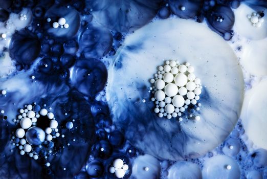 abstract nbackground or texture beads in a blue oil solution