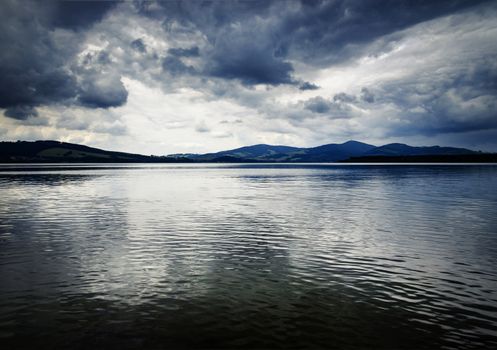 nature background landscape with lake before the storm