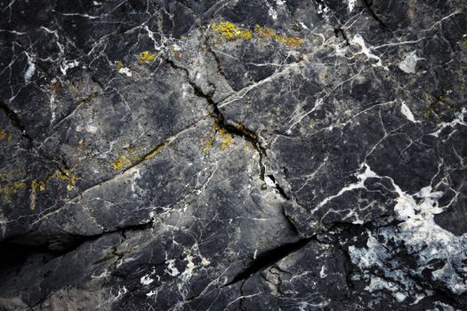 abstract background the dark surface of the old limestone rocks