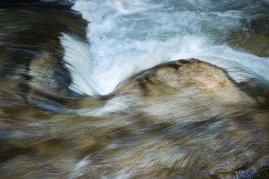 abstract nature background detail blurred rapids on the river