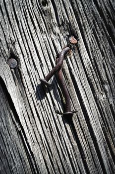 abstract background or texture two rusty nails on the old board