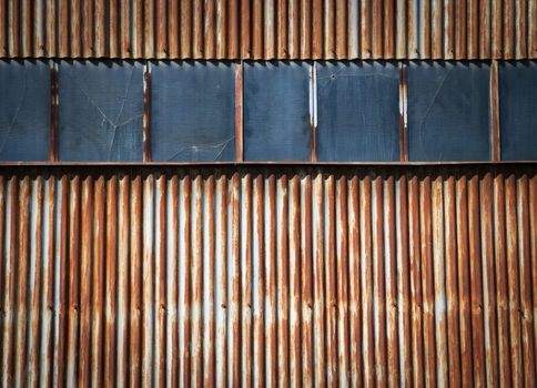 abstract background or texture a rusty metal gate with windows