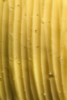 abstract background scratches on a piece of cheese