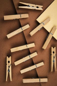 abstract background wooden pins attached to brown paper