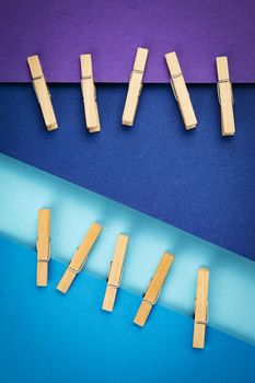 abstract background wooden pins attached to blue paper