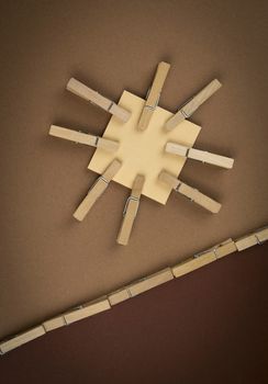 abstract composition with brown colored paper wooden pins