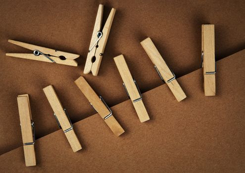 background or texture wooden pins on brown paper