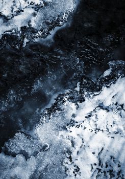 abstract background or texture ice on the dark river