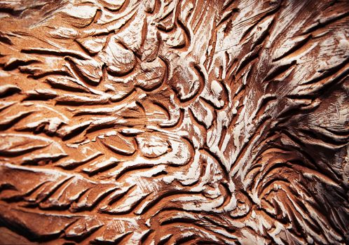abstract background or texture pattern scraped into brown clay