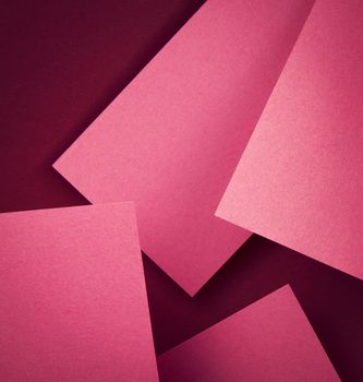 abstract Pink paper on burgundy background