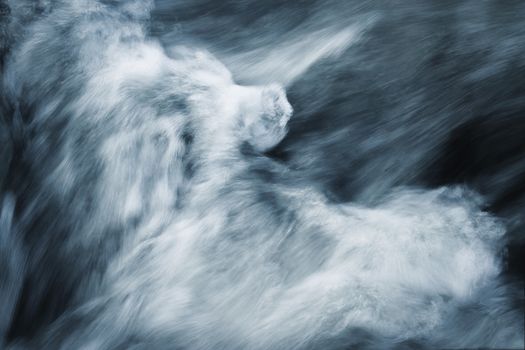 abstract background dark blurred rapids of the river