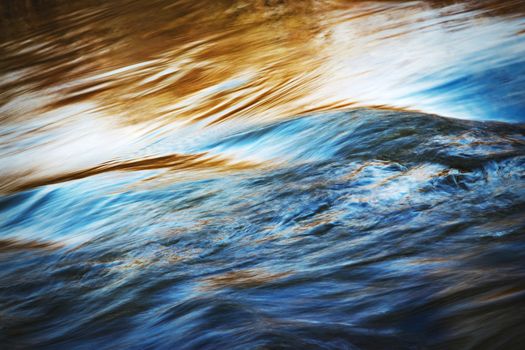 nature background abstract wave on the autumn river