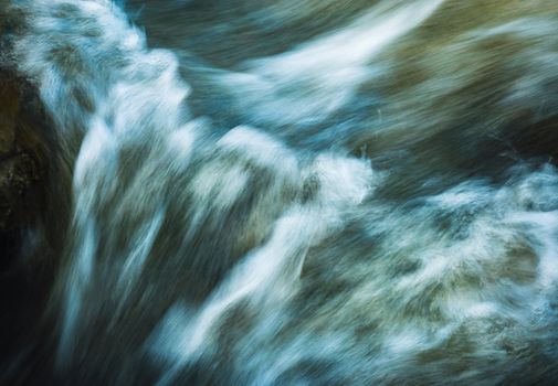 abstract background blurred rapids of the river