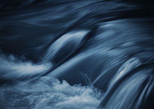 dark blue ripples on the river