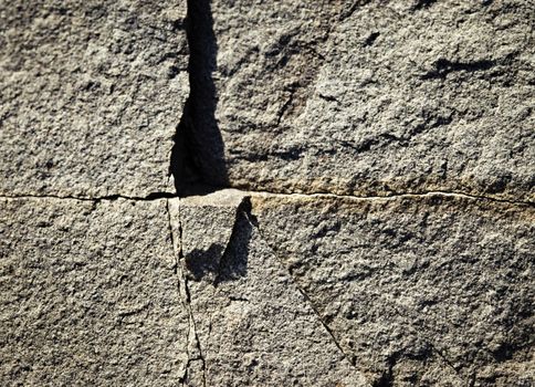 abstract background or texture detail gray cross crack in stone