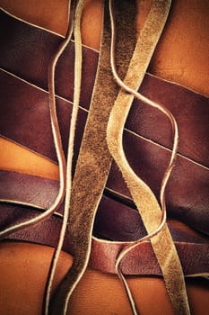 abstract background cut brown leather straps