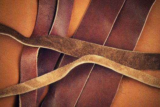 abstract background cut brown leather straps