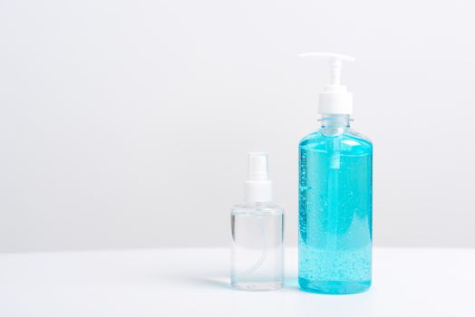 Plastic dispenser sanitizer alcohol gel pump and spray bottle for washing hand hygiene prevention of coronavirus virus studio shot on white background