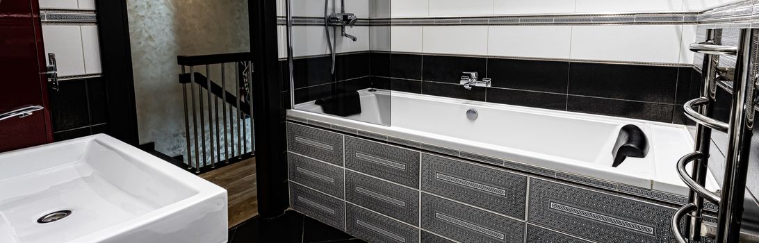 Interior of a modern bright bathroom with a sink and toilet