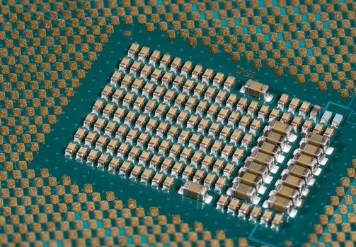Macro photo of the center of the CPU chip ready for insertion into a modern personal computer motherboard