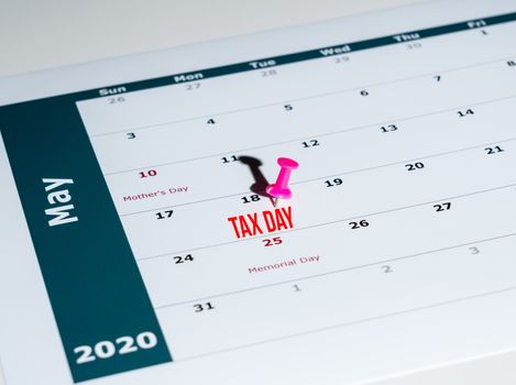 Reminder for sending income tax return for May 18 2020 tax day due to Covid-19 virus delay using calendar page and pin