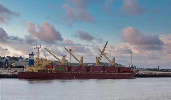 A red tanker at an industrial port in Saint John, New Brunswick, Canada