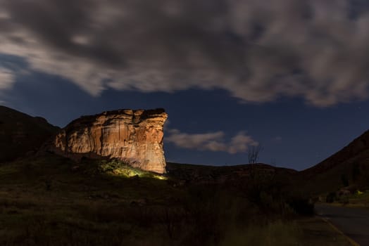 The Brandwag Buttress at night, lit by floodlights, in Golden Gate in the Free State Province