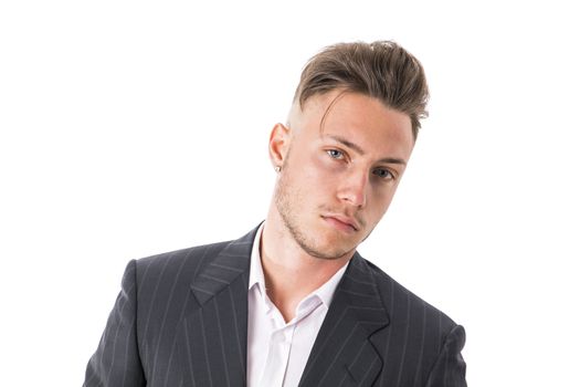 Shot of handsome elegant young man with suit and neck-tie, isolated on white, looking at camera