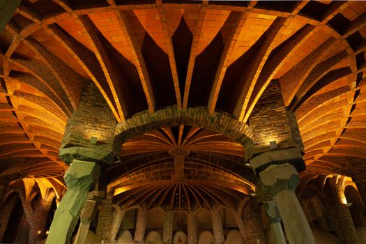 Santa Coloma de Cervello, Spain - 15 January 2019: Church of Colonia Guel interior ceiling and columns