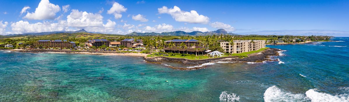 Wide panorama of the coastline around Lawa'i beach near Poipu on the south coast of Kauai