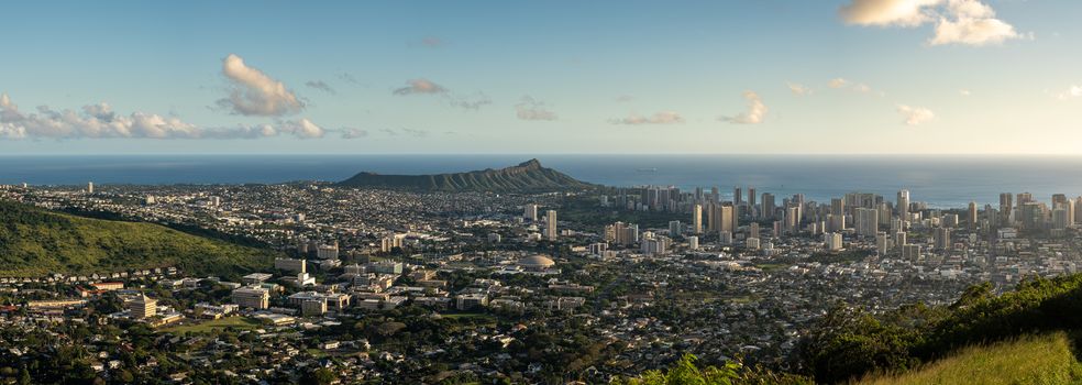 Wide panoramic image of sunset over Waikiki, Honolulu and Diamond Head from the Tantalus Overlook on Oahu, Hawaii