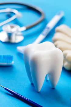 Dental model and dental equipment on blue background, concept image of dental background. dental hygiene background