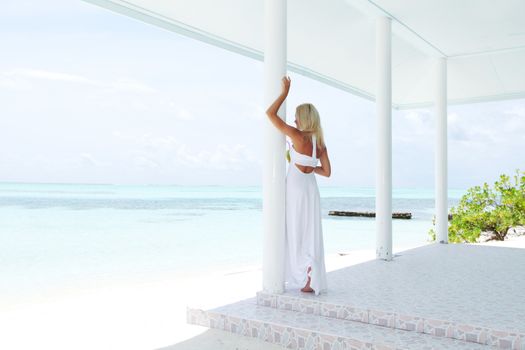 woman on the veranda of the tropical house