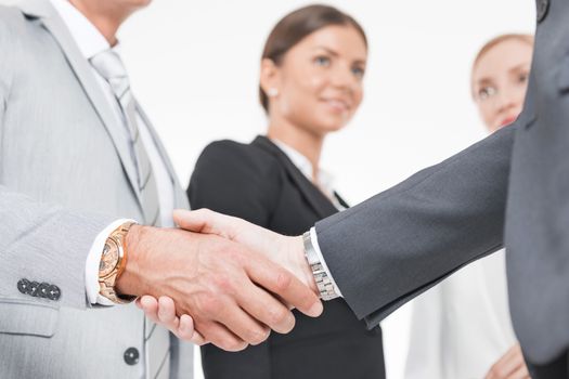 Business handshake of business people team on white