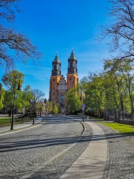 Colorful cathedral square in front of basilica of Saint Peter and Paul in Poznan city at sunny morning