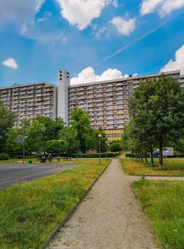Residential buildings and apartments with colorful park and playgrounds in front of at sunny day in Wroclaw city