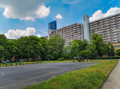 Residential buildings and apartments with colorful park and playgrounds in front of at sunny day in Wroclaw city