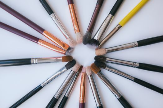 Makeup brush in the form of a circle on white backround.