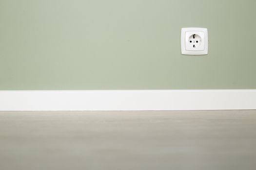 Empty wall and floor background of scandinavian room interior with white plinth and socket close up , copy space for text , renovation , new home ownership concept