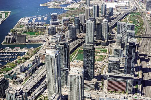 Aerial views of Toronto downtown and harbor shot from the top of CN Tower, Canada.