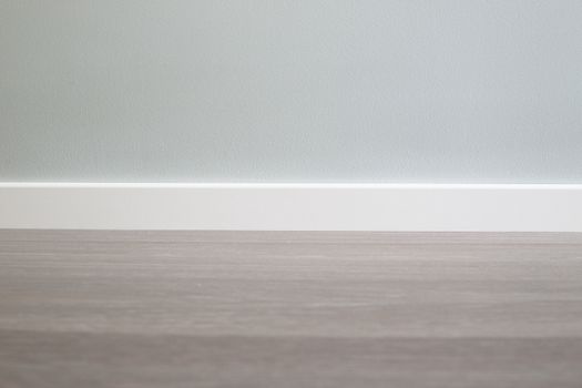 Empty wall and floor background of scandinavian room interior with white plinth close up , copy space for text , renovation , new home ownership concept