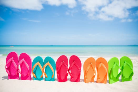 Colorful flip flops on the sandy beach in Hawaii, Kauai