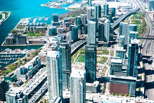 Aerial views of Toronto downtown and harbor shot from the top of CN Tower, Canada.